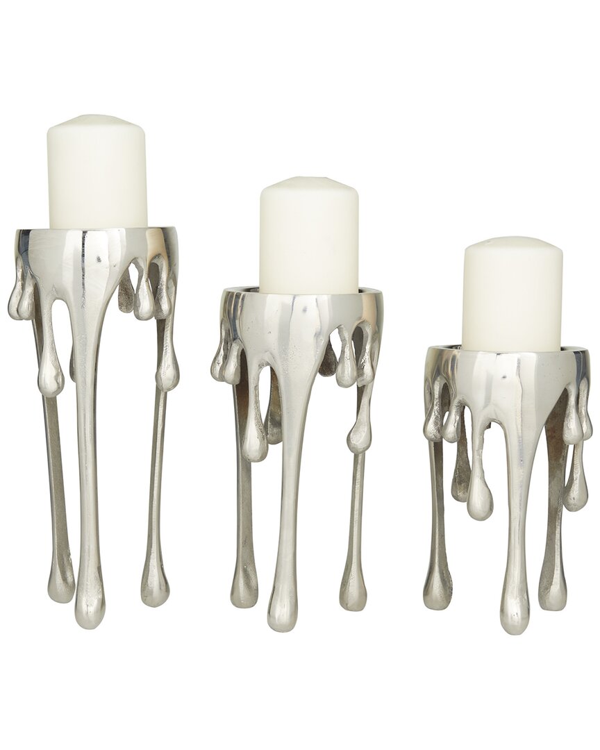 COSMOLIVING BY COSMOPOLITAN DNU COSMOLIVING BY COSMOPOLITAN SET OF 3 SILVER ALUMINUM ABSTRACT PILLAR DRIP CANDLE HOLDER WITH MEL