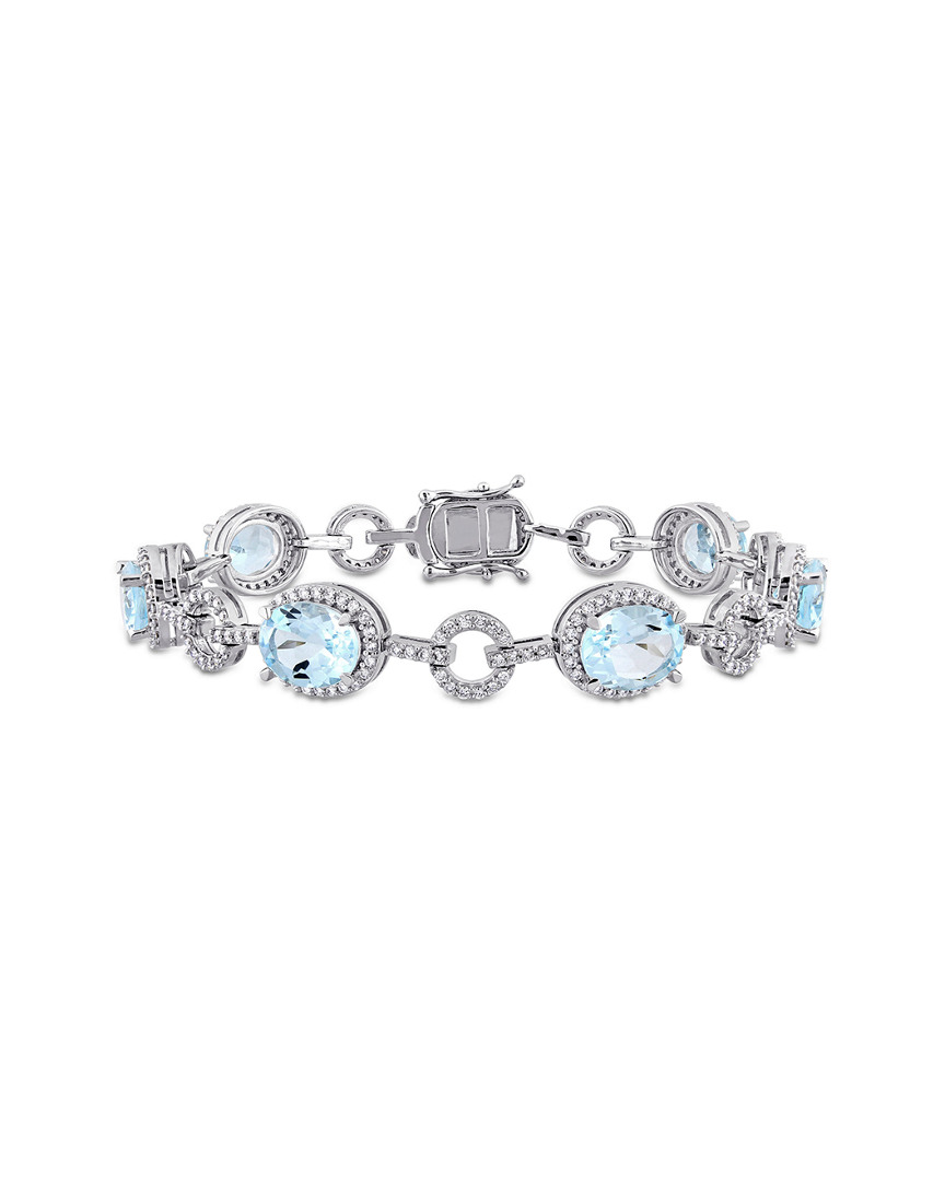 Image of K . ct. tw. Diamond & Sky Blue Topaz Bracelet